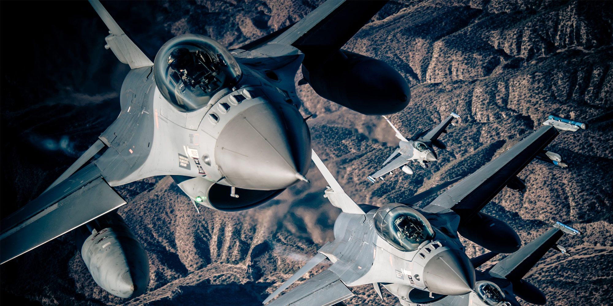 Northrop Grumman F-16 Electronic Warfare Suite F-16's in air over mountains
