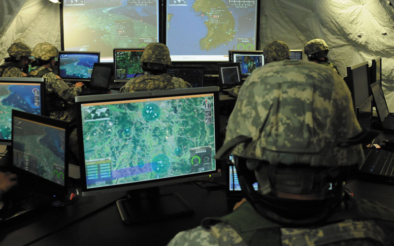 Soldiers sit in command room