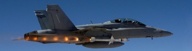 military fighter jet about to fire missile