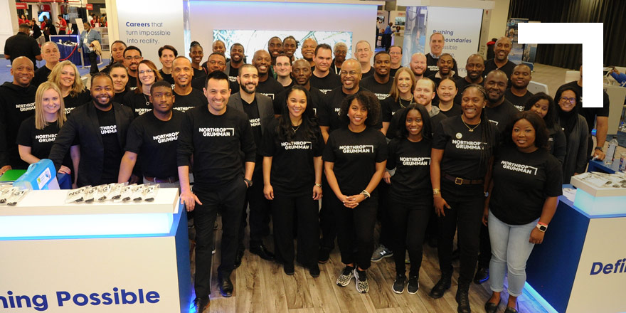group of employees in black t-shirts