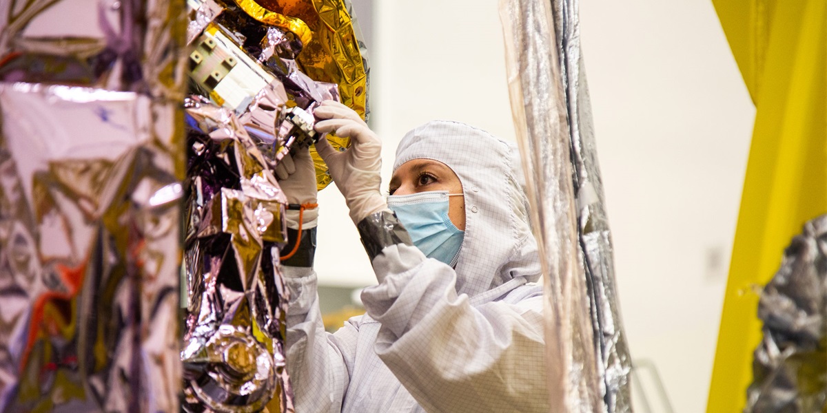 Female engineer working on spacecraft