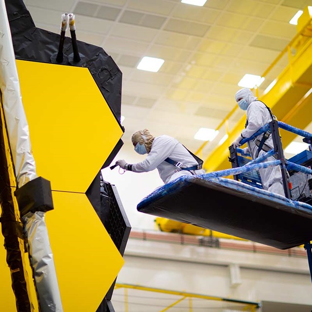workers on JWST