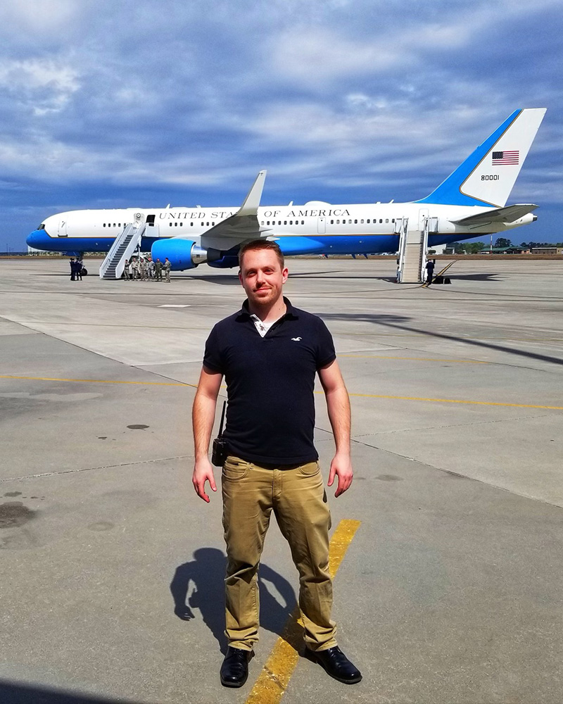 White male standing in front of Air Force One