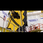 technicians working on James Webb Space Telescope in cleanroom