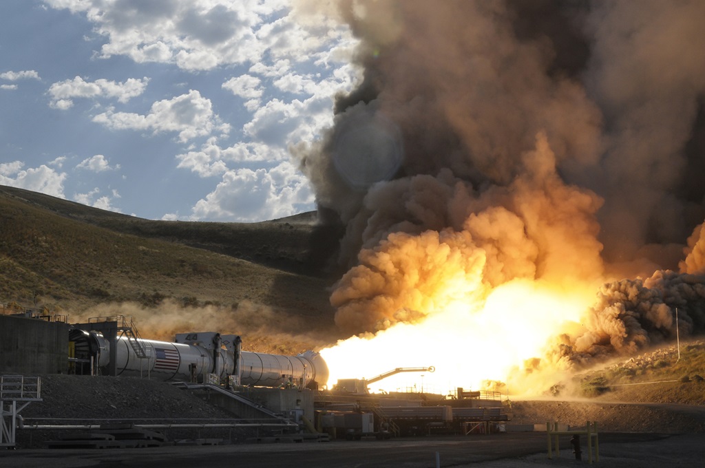 rocket engine laying horizontal and firing in a test scenario