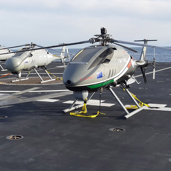 3 heliocopters on deck of ship