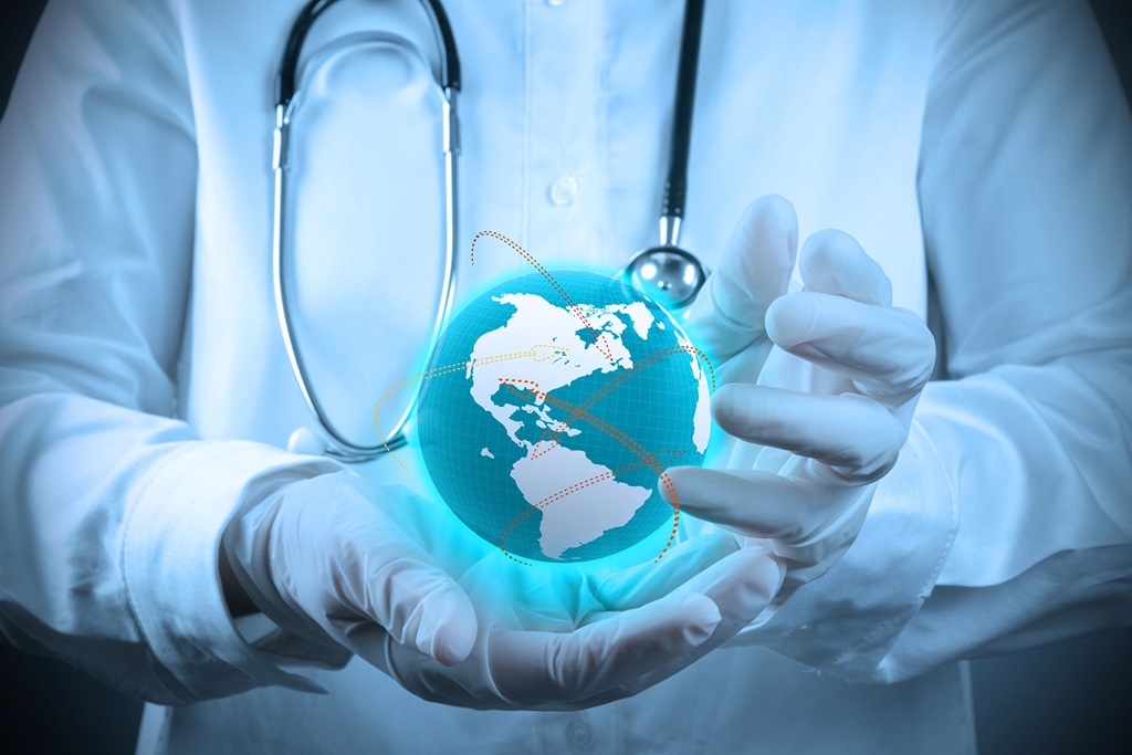 doctor with lab coat and gloves holding globe