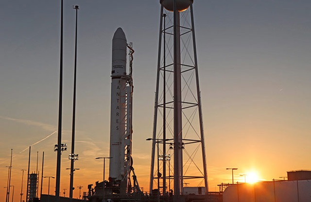 rocket on launchpad at sunrise