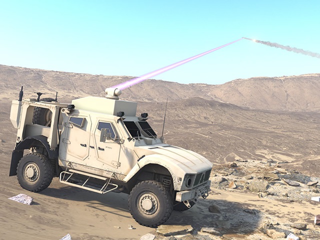 Military vehicle shooting down target with directed energy laser