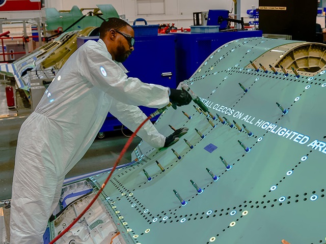 black male working on F-35 production line