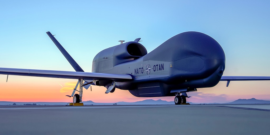 Unmanned plane on tarmac at sunset