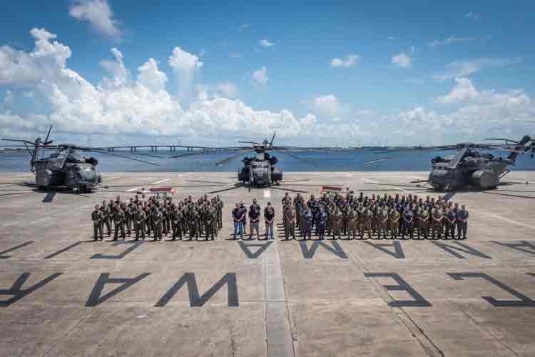 3 MH-53E helicopters and personnel after the successful AQS-24C trials held in Panama City