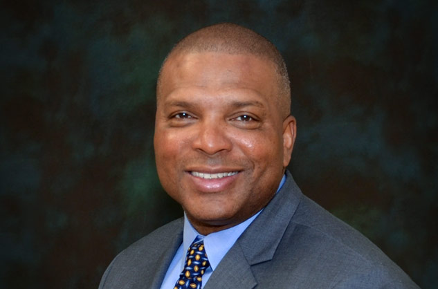 headshot of black male executive