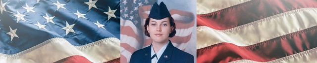 female soldier in front of flag